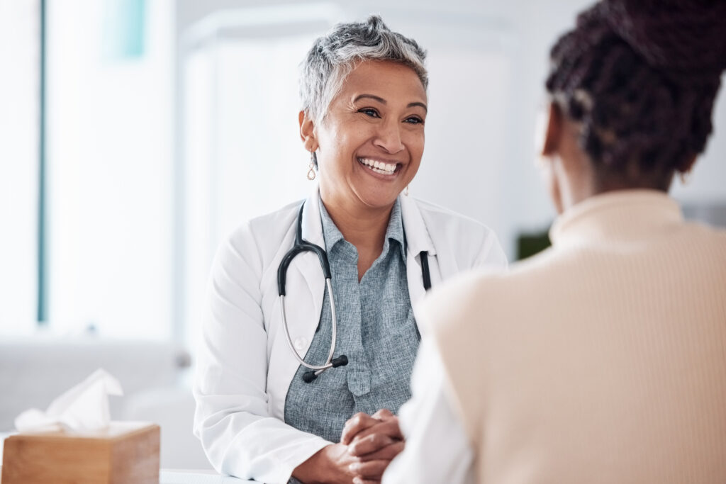 Healthcare provider speaking with patient about health and mental wellness — promoting collaborative care