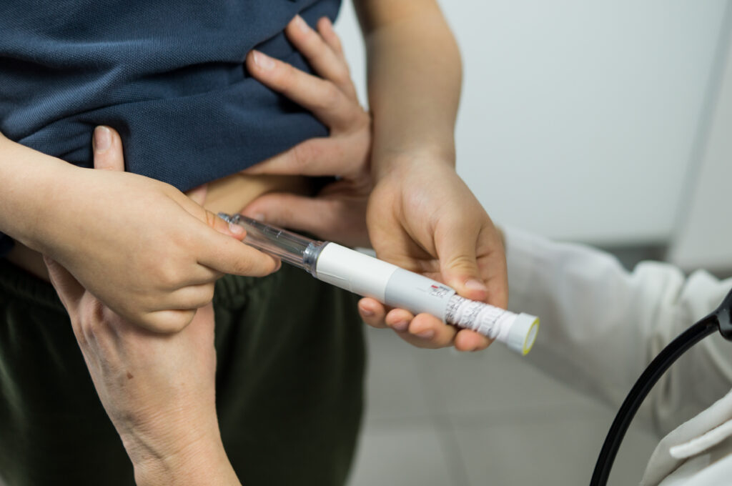 Young patient injecting